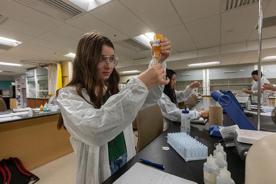 Two students in their Chemistry Lab