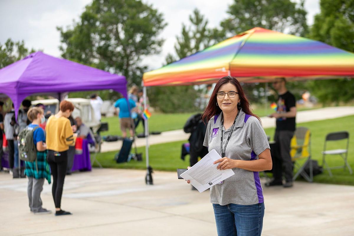 San Juan College employee at student rush.